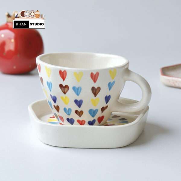 ceramic mugs and saucer