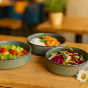 Khan Ceramic sage green ceramic serving bowls with brown rim